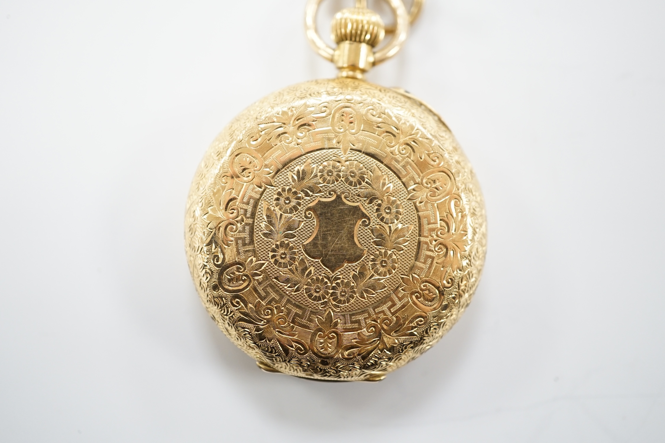 A continental engraved 18k gold open face fob watch, with Roman dial, gross weight 38.5 grams.